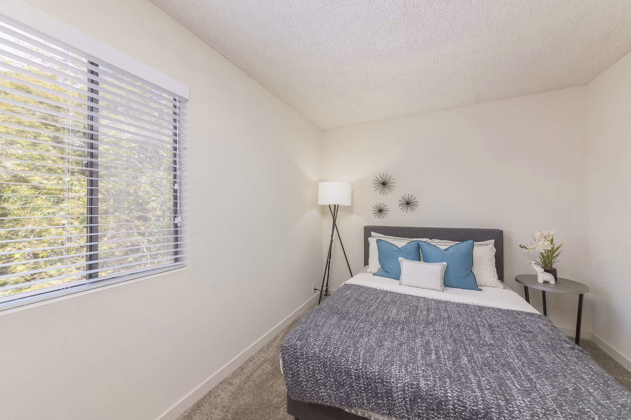 Elegant bedroom with modern decor at The Hilltop Apartments