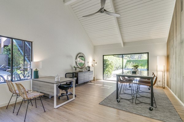 The Hilltop Apartments: Modern clubhouse with stylish seating and natural light, enhancing luxury apartment living in city setting