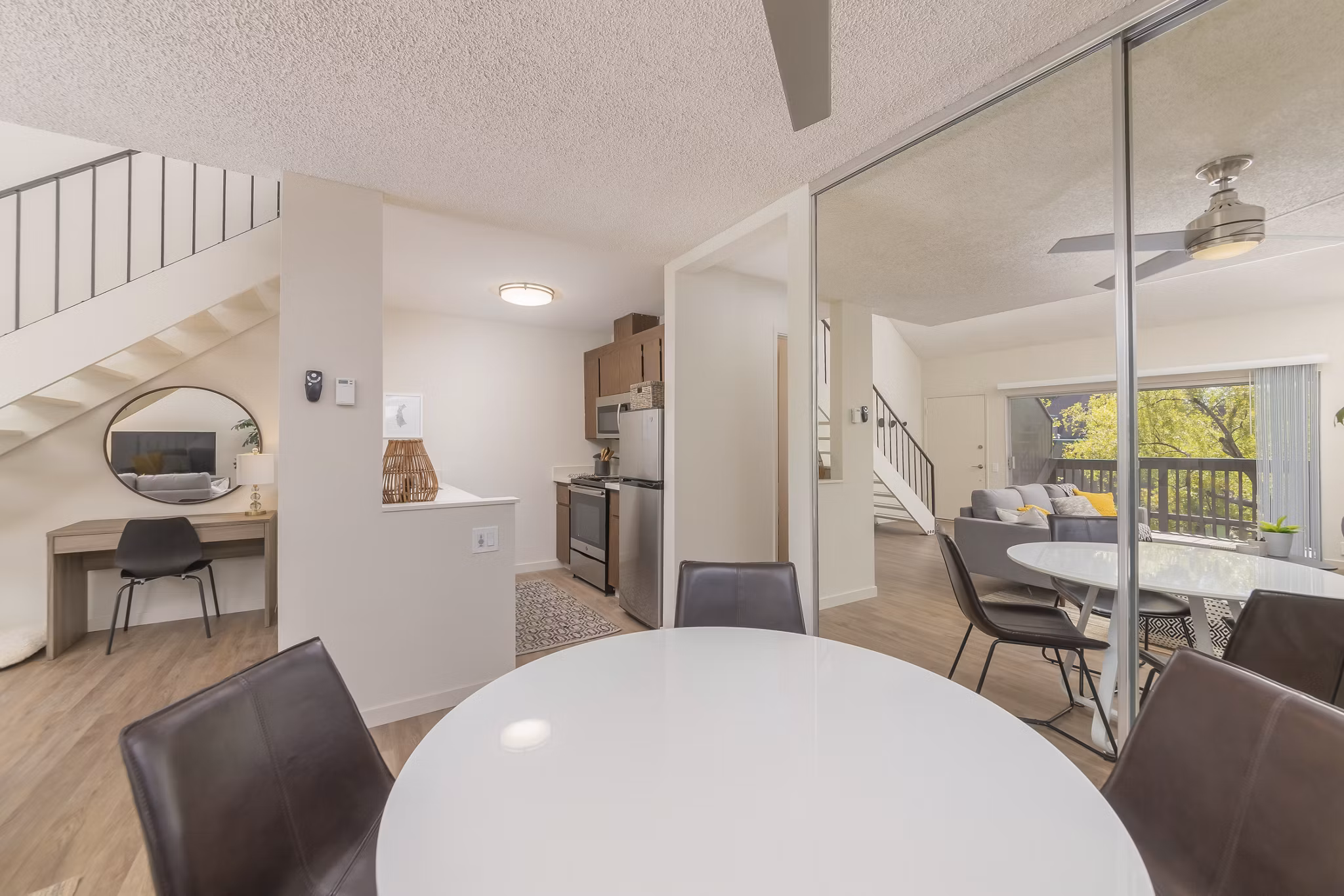 Dining area featuring modern decor and large windows at The Hilltop Apartments, a luxurious Greystar community