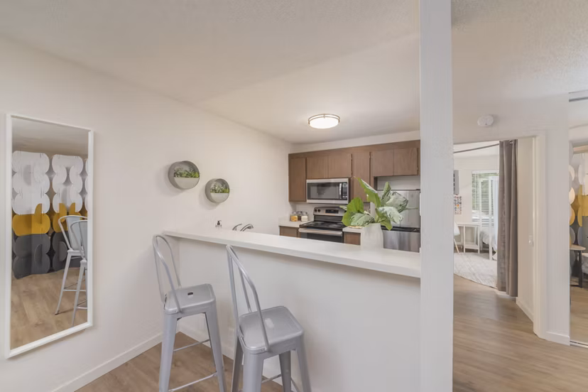 The Hilltop Apartments: Modern kitchen with sleek countertops and stainless steel appliances