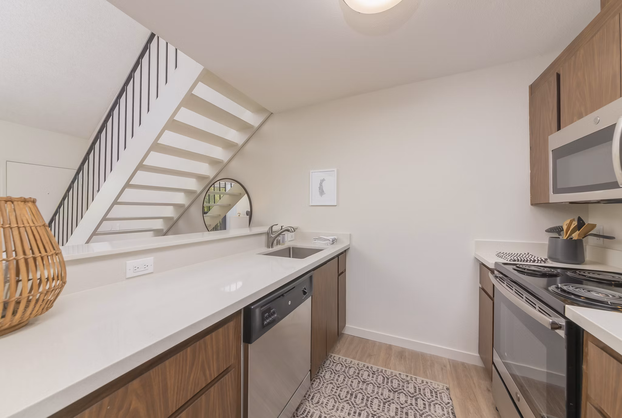 Modern kitchen with stainless steel appliances at The Hilltop Apartments, a luxury property by Greystar