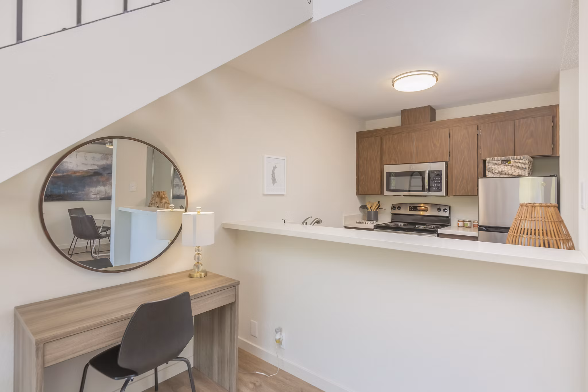 Modern kitchen with stainless steel appliances at The Hilltop Apartments