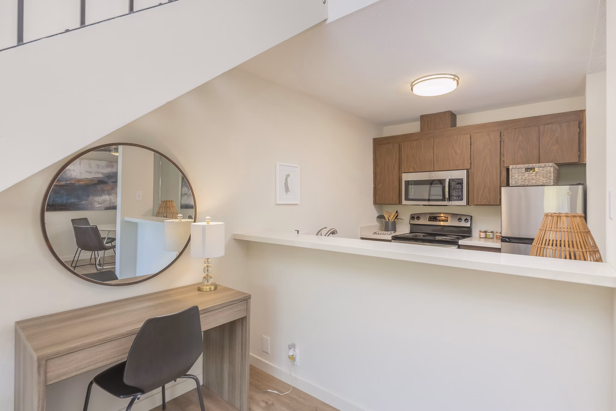 Modern kitchen with stainless steel appliances at The Hilltop Apartments