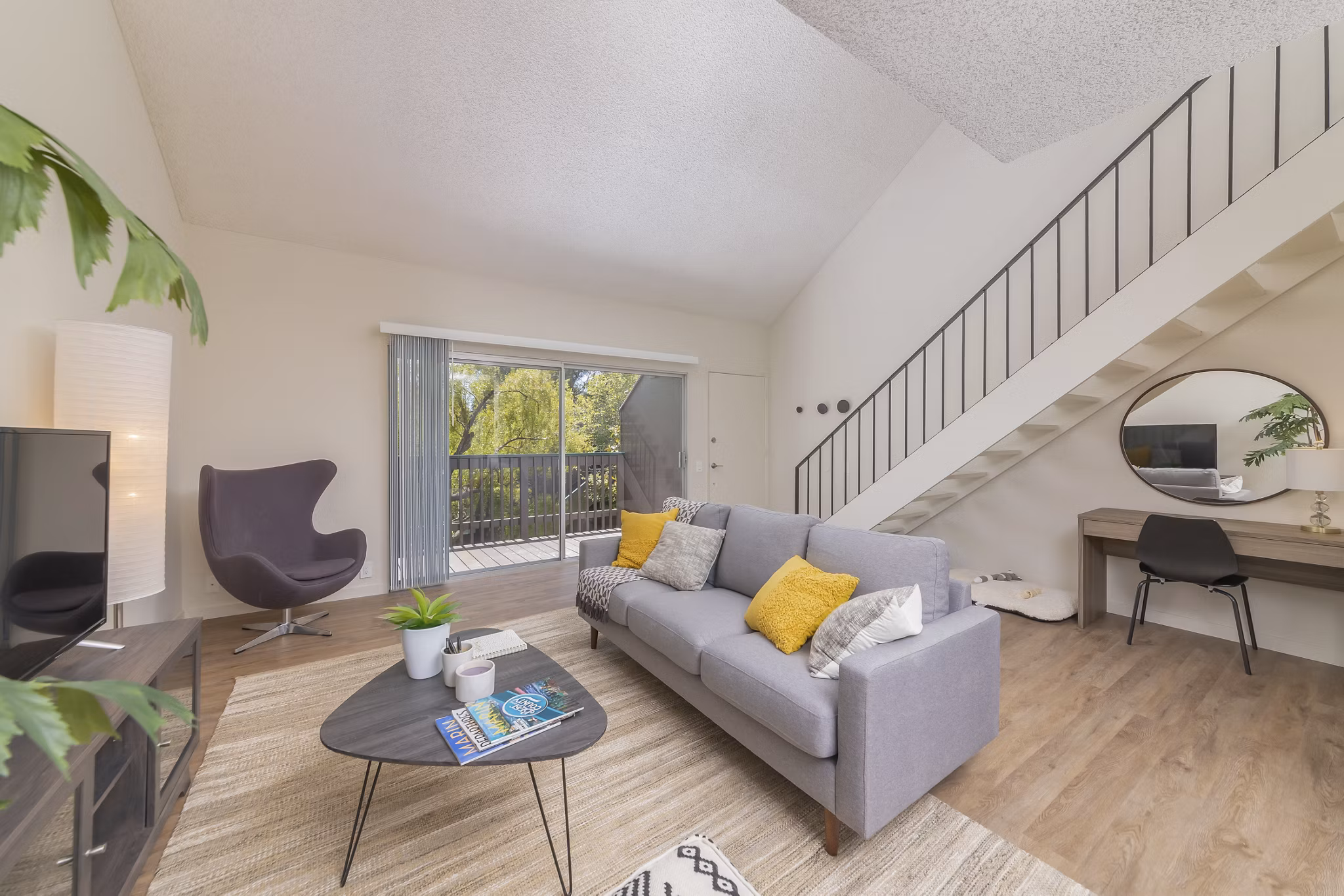Spacious living room with elegant decor and natural light at The Hilltop Apartments, a Greystar luxury property