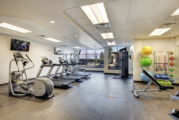 Fitness center at The Pacifica Apartments featuring state-of-the-art equipment in urban luxury living experience
