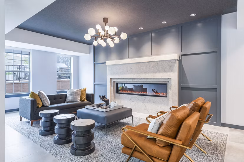 Clubhouse lobby with modern seating and artwork at Delwyn Apartments