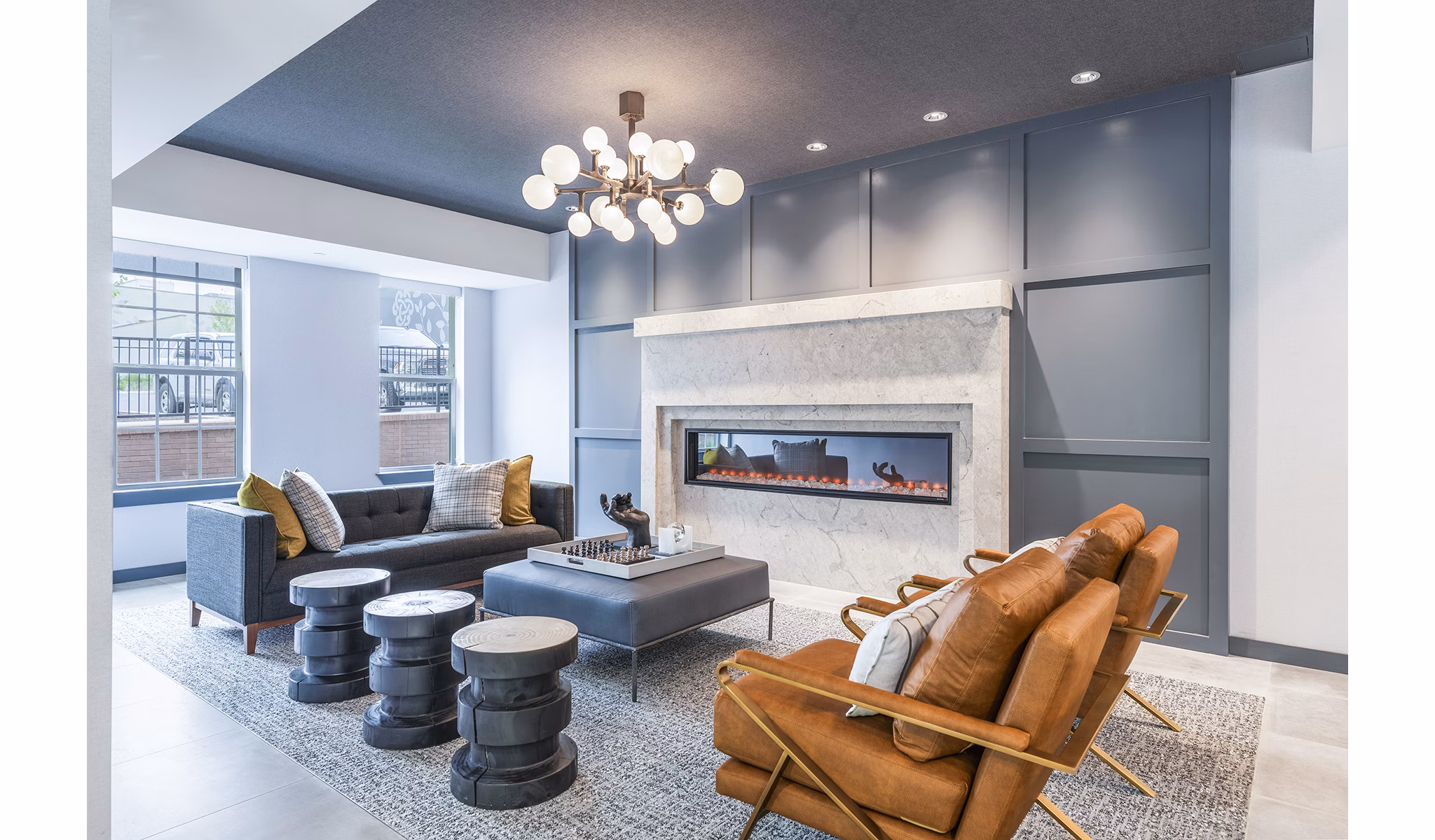 Clubhouse lobby with modern seating and artwork at Delwyn Apartments