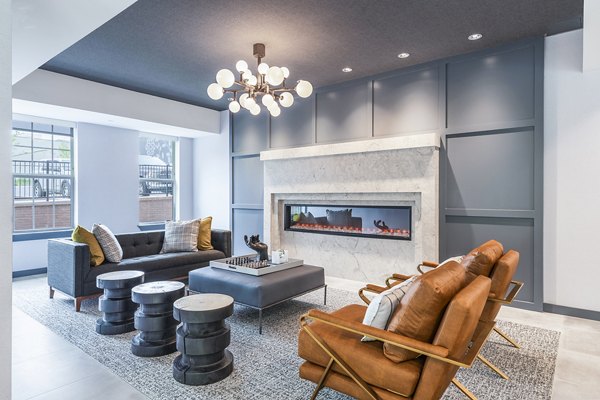 Clubhouse lobby with modern seating and artwork at Delwyn Apartments