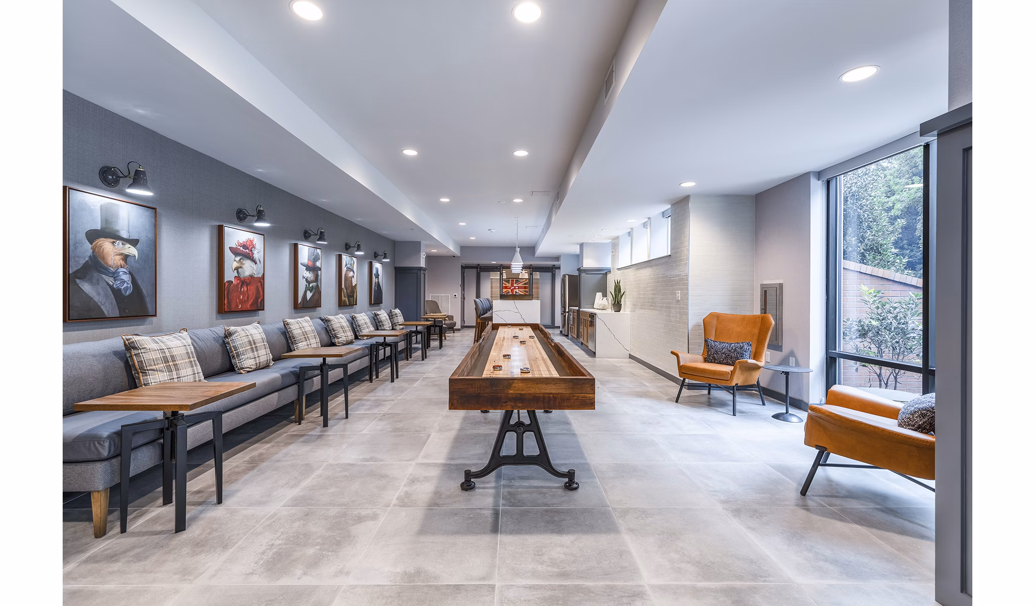 Game room with billiards and lounge seating at Delwyn Apartments