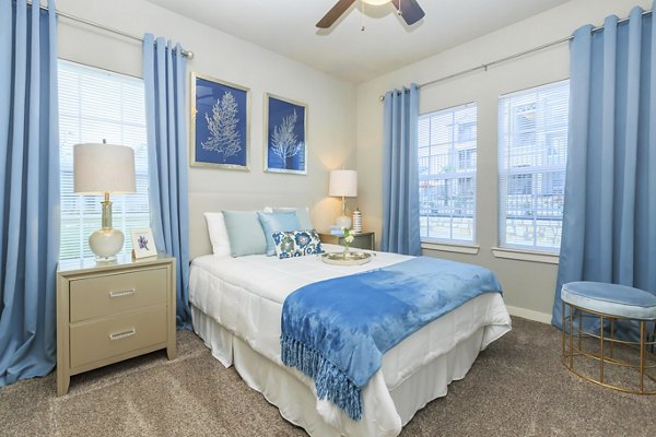 Cozy bedroom with modern decor in Vantage at Boerne Apartments, featuring serene ambiance and stylish furnishings for ultimate comfort