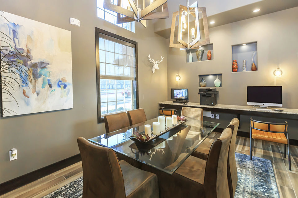 Modern business center with ergonomic seating and high-speed internet at Vantage at Boerne Apartments, offering a productive workspace
