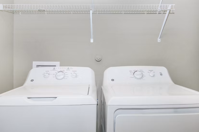 Laundry room with state-of-the-art appliances at Vantage at Boerne Apartments