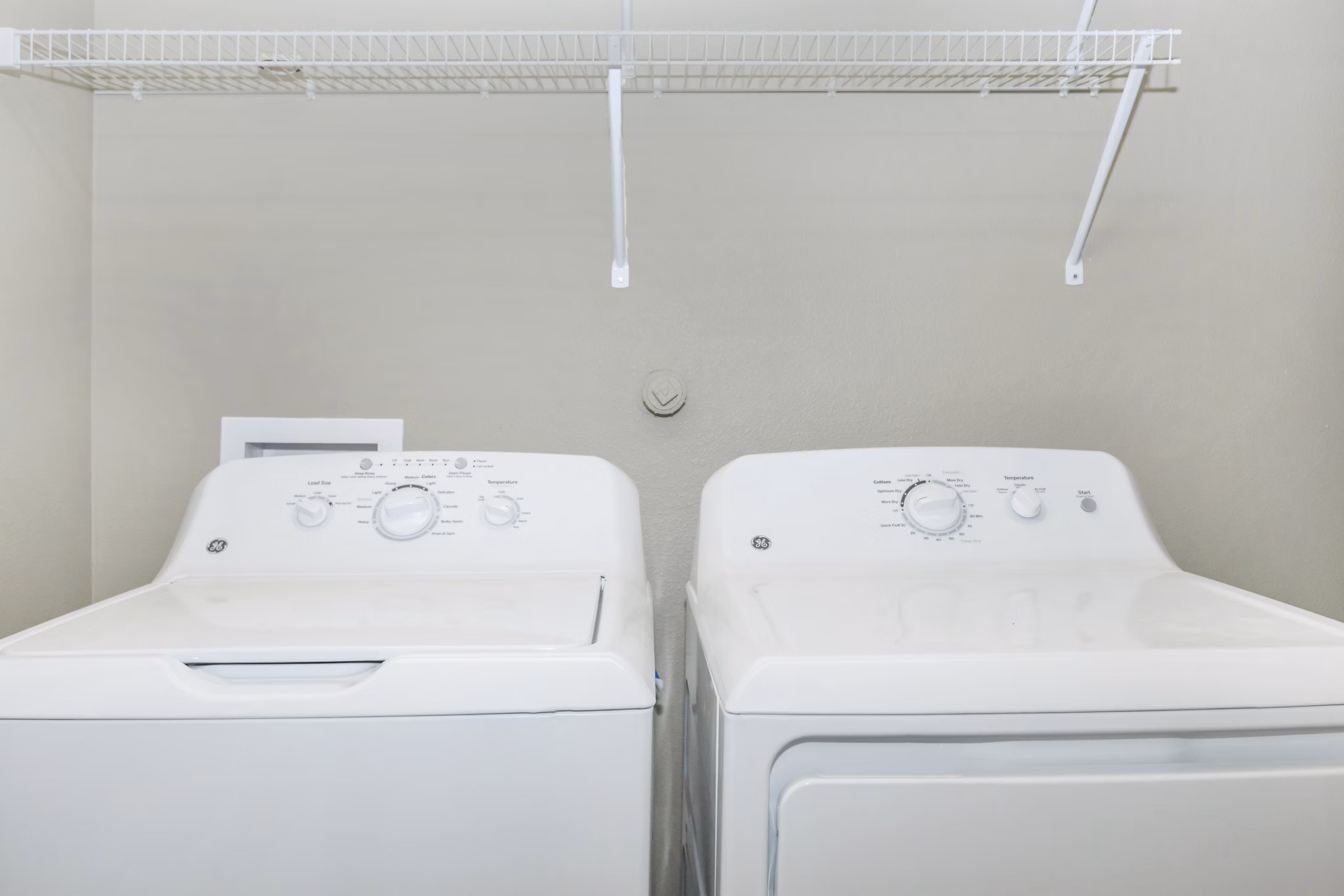 Laundry room with state-of-the-art appliances at Vantage at Boerne Apartments