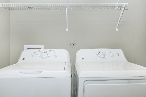 Laundry room with state-of-the-art appliances at Vantage at Boerne Apartments