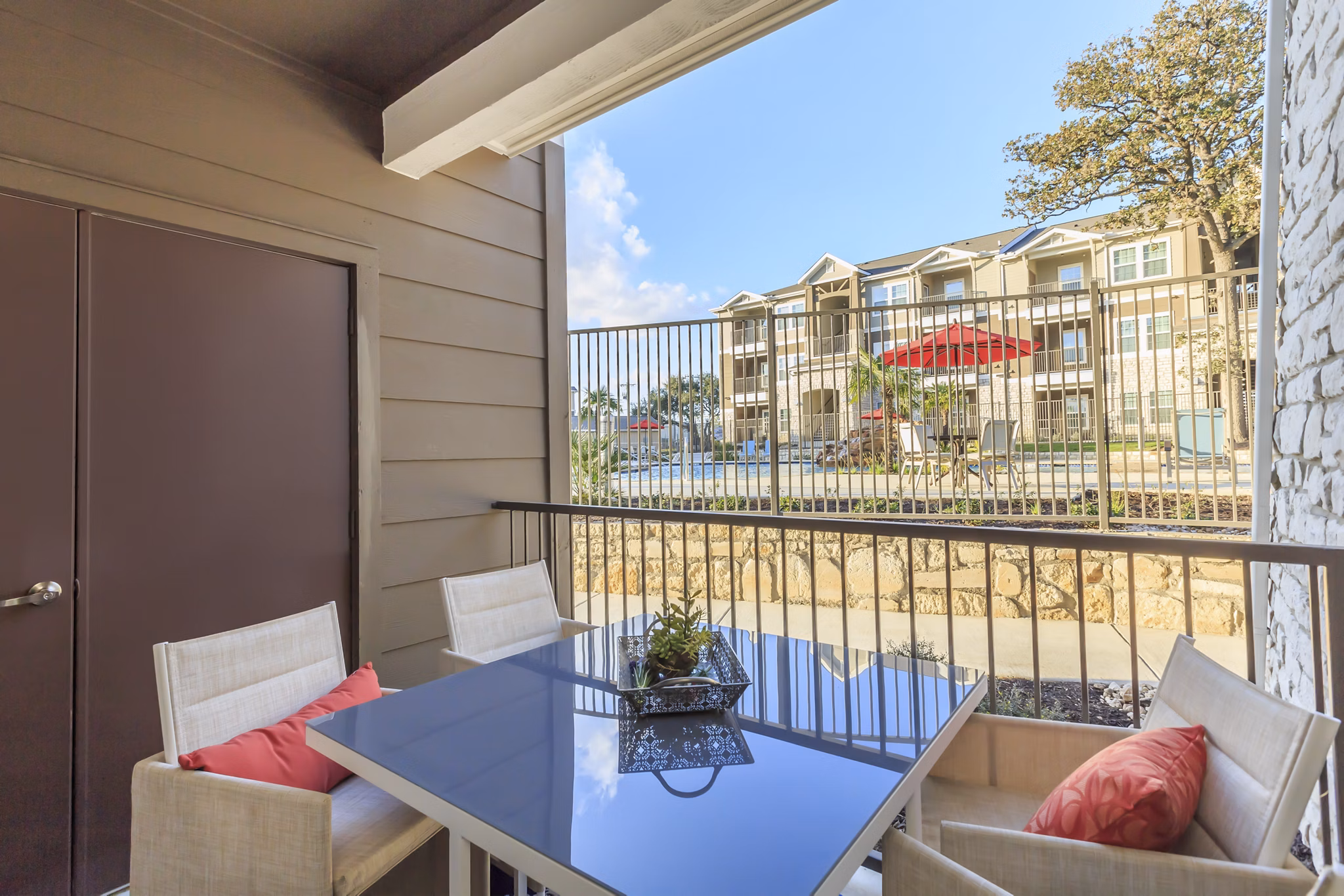 Spacious outdoor patio with comfortable seating at Vantage at Boerne Apartments
