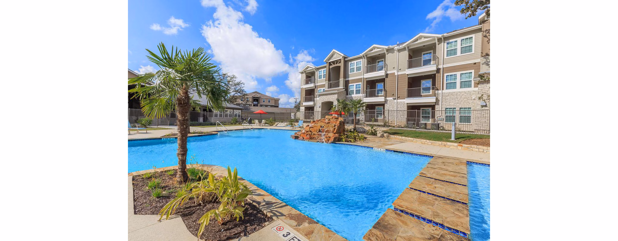 Luxurious poolside at Vantage at Boerne Apartments with scenic views
