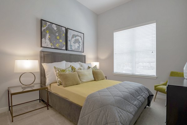 Modern bedroom with elegant decor at Aston City Springs Apartments