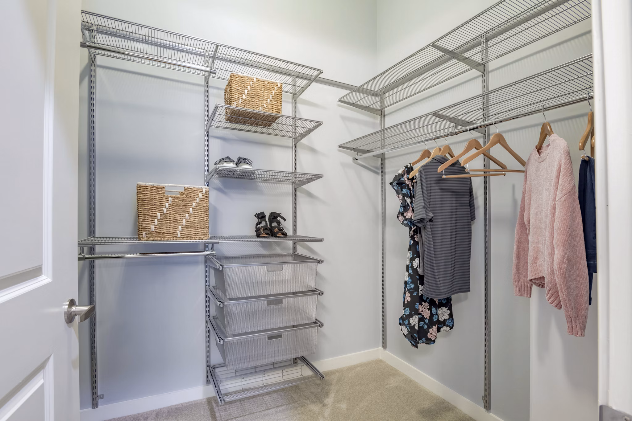 Walk-in closet with ample shelving in Aston City Springs Apartments