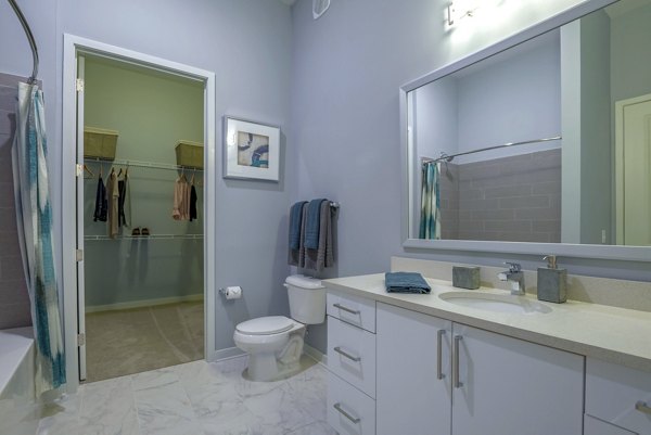 Luxurious bathroom with elegant fixtures in Aston City Springs Apartments, offering modern comfort and style for a premium living experience
