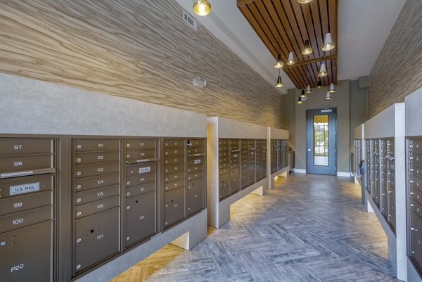 Mailroom equipped with lockers at Aston City Springs Apartments