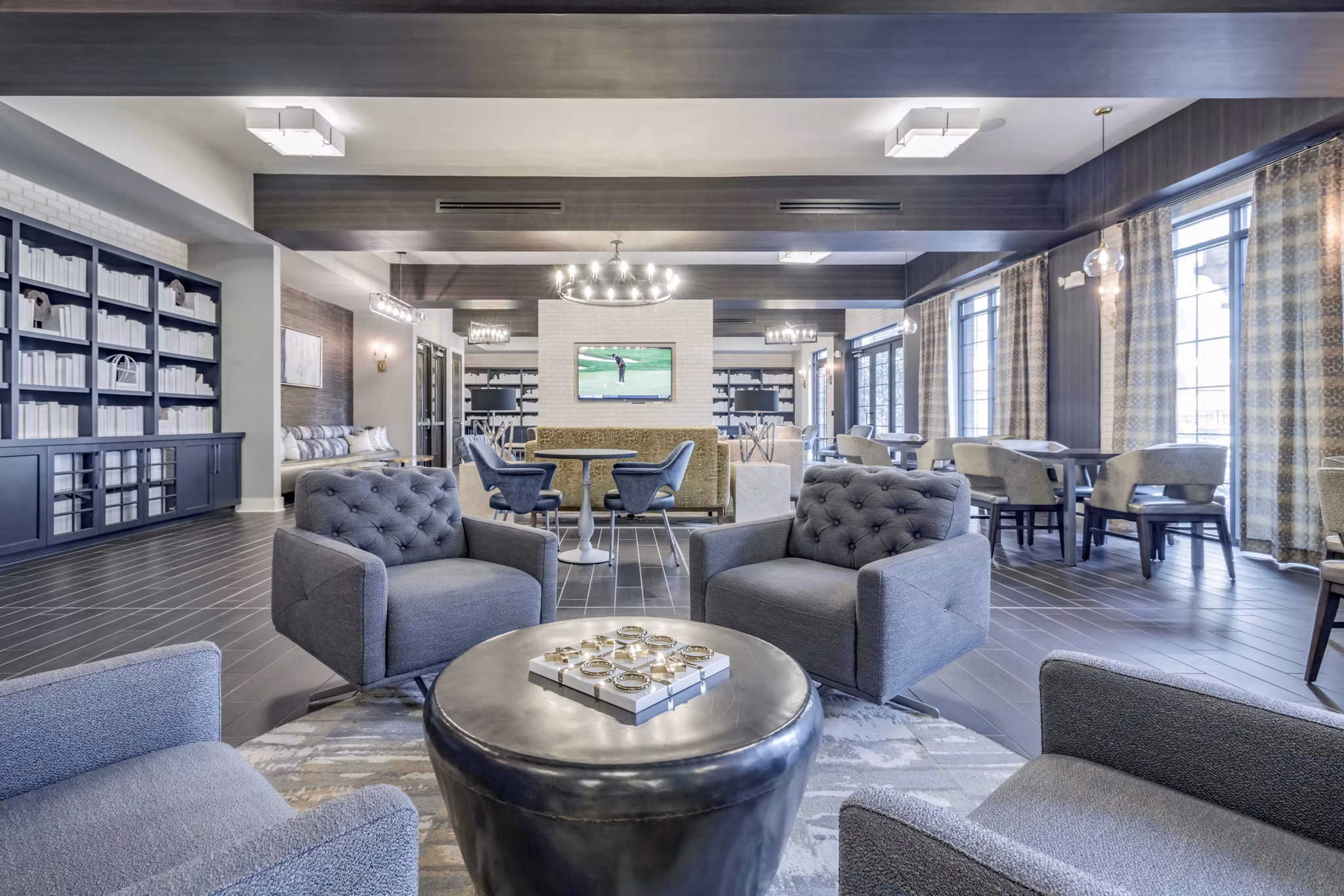 Clubhouse featuring modern design and comfortable seating at Aston City Springs Apartments