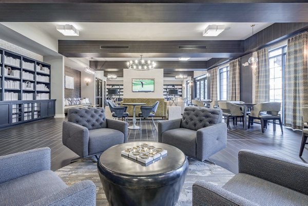 Clubhouse featuring modern design and comfortable seating at Aston City Springs Apartments