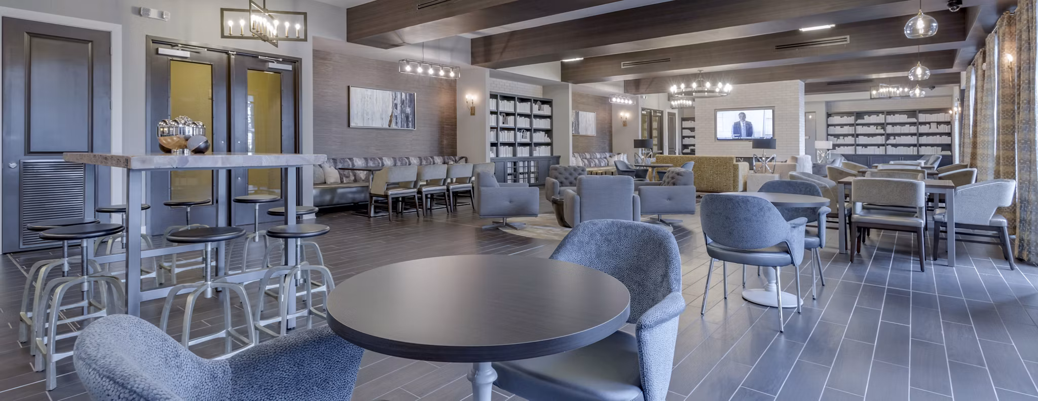 Clubhouse with contemporary decor and seating at Aston City Springs Apartments