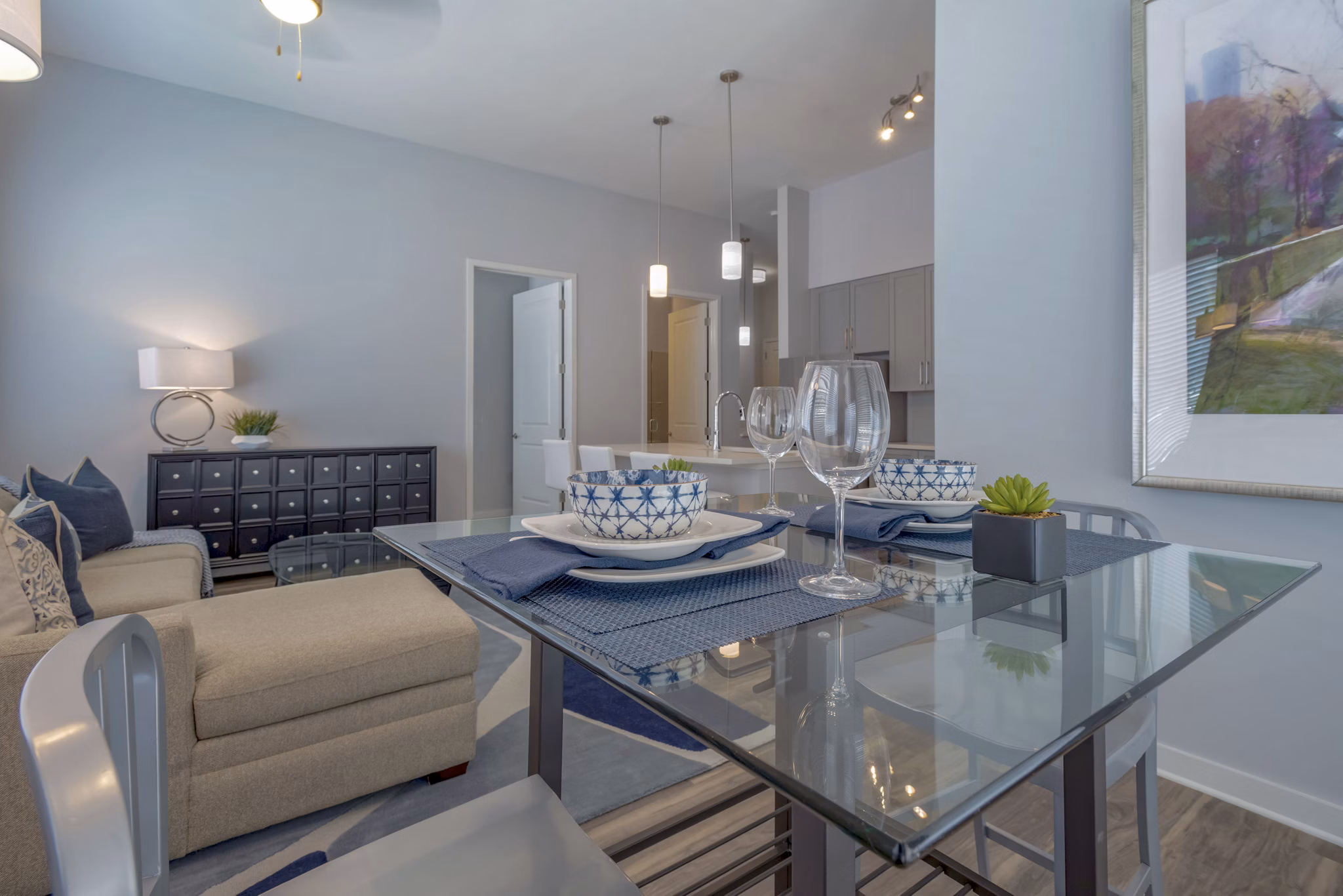 Dining area with modern furnishings at Aston City Springs Apartments featuring a stylish table and chairs for luxury living
