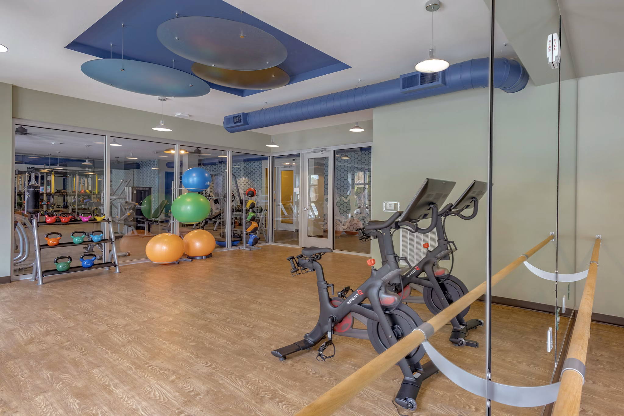 Yoga/spin studio with modern equipment at Aston City Springs Apartments
