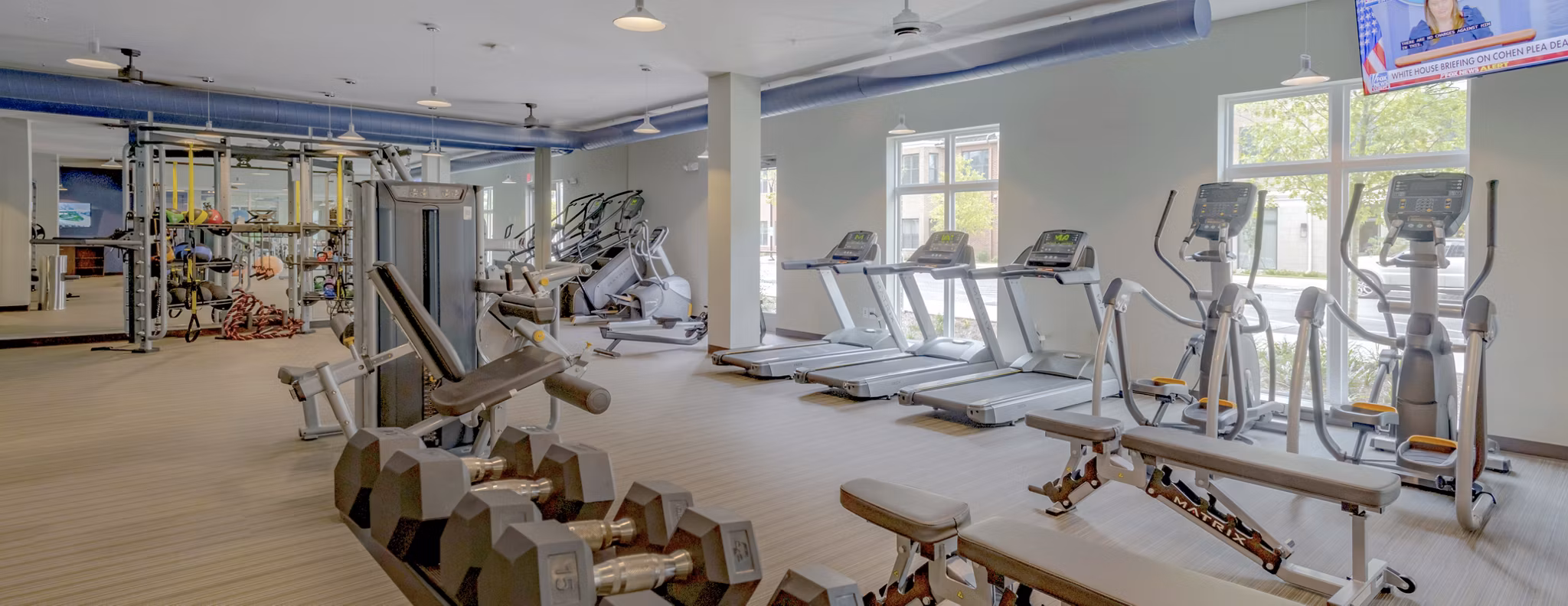 State-of-the-art fitness center at Aston City Springs Apartments featuring modern workout equipment and open exercise spaces