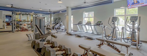 State-of-the-art fitness center at Aston City Springs Apartments featuring modern workout equipment and open exercise spaces