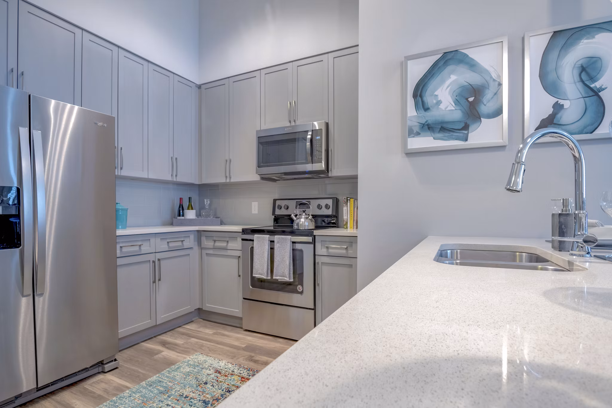 Modern kitchen with stainless steel appliances in Aston City Springs Apartments