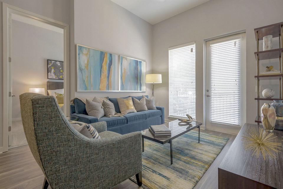 Spacious living room with modern decor in Aston City Springs Apartments