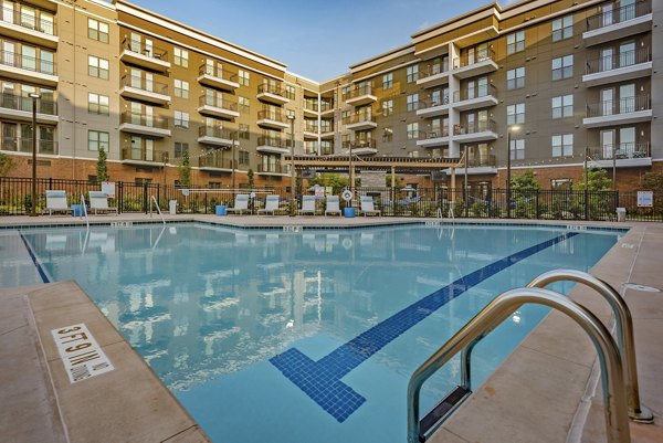 Stunning rooftop pool with city skyline views at Aston City Springs Apartments