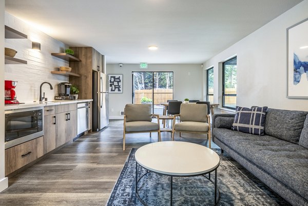 Clubhouse featuring a modern lounge and recreational space at Alvista 240 Apartments