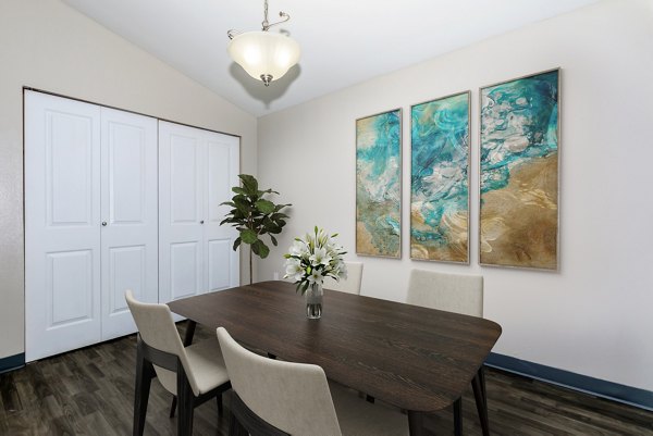 Dining area featuring modern decor and ample seating in Alvista 240 Apartments, offering a luxurious living experience