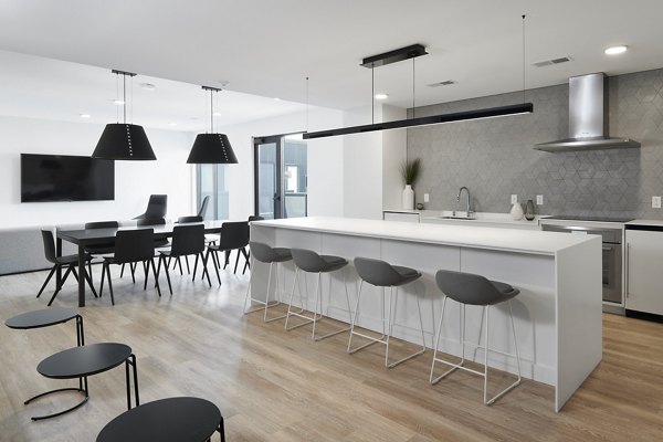 Clubhouse at Second and Second Apartments featuring modern design and cozy seating areas