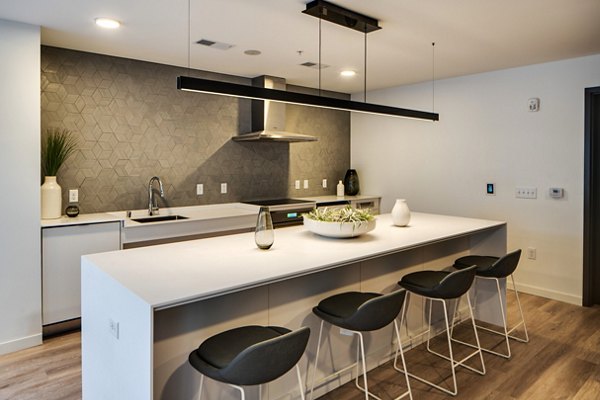 Clubhouse with modern furnishings and ample seating at Second and Second Apartments