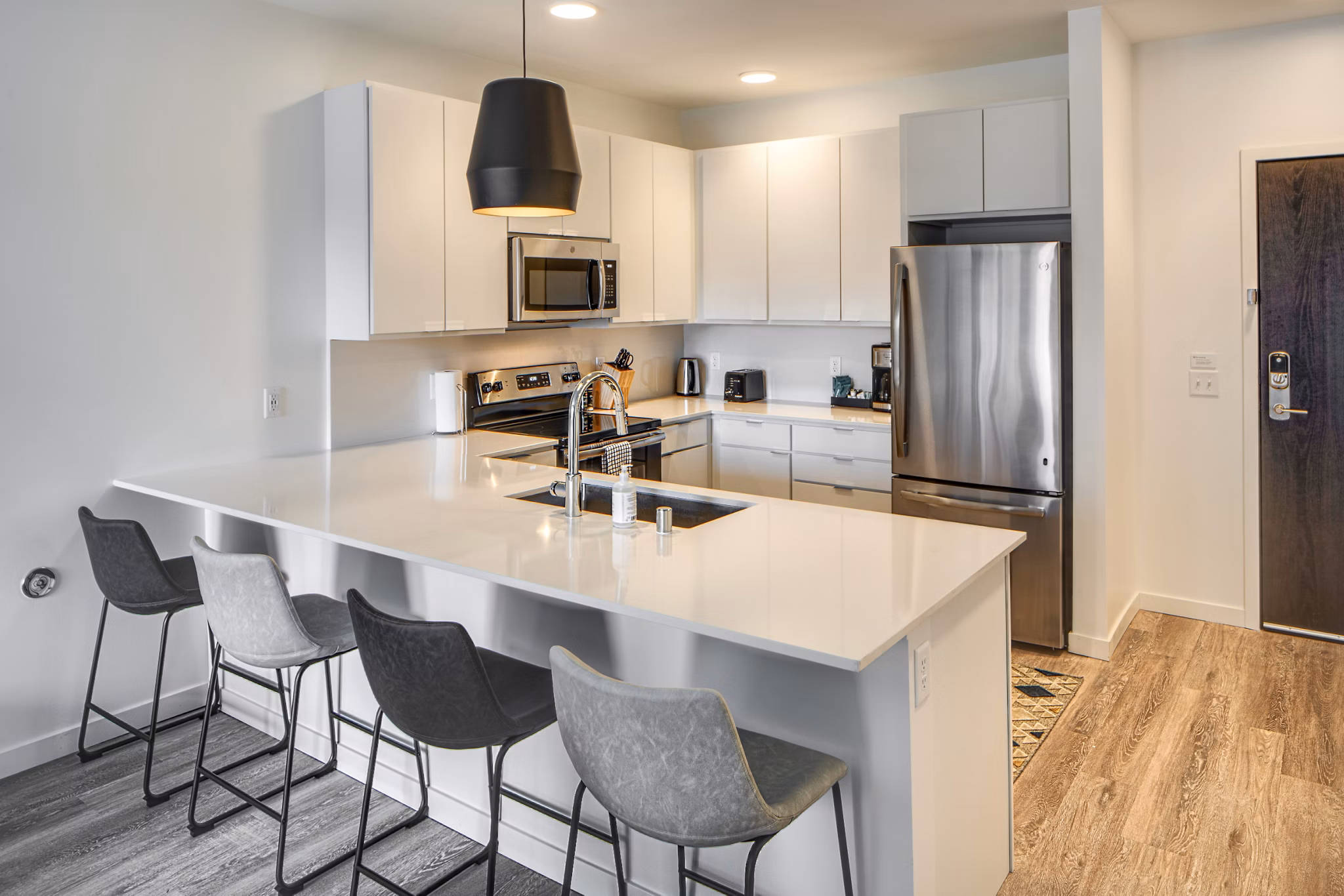Modern kitchen with stainless steel appliances at Second and Second Apartments luxury complex