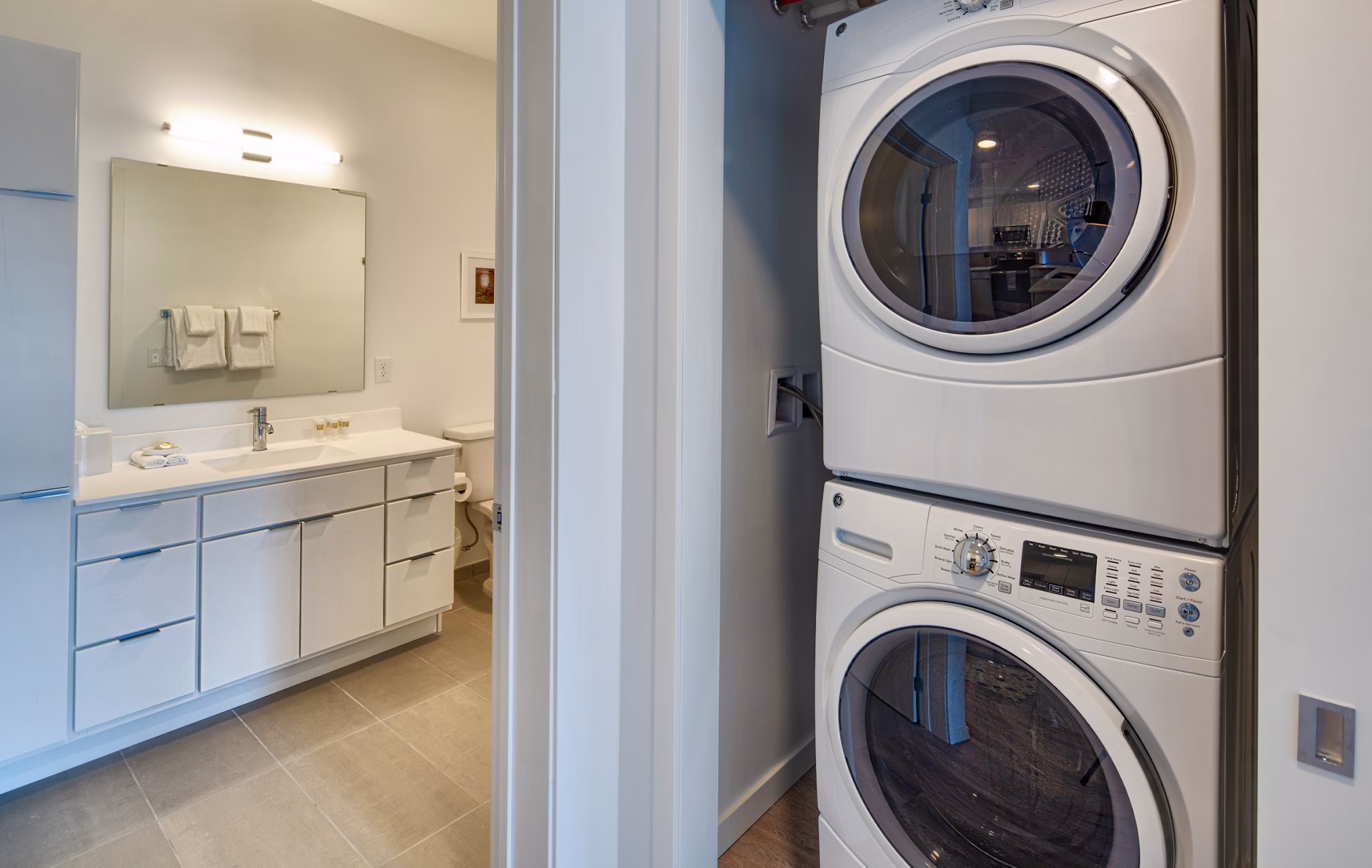 Laundry room equipped with modern appliances at Second and Second Apartments
