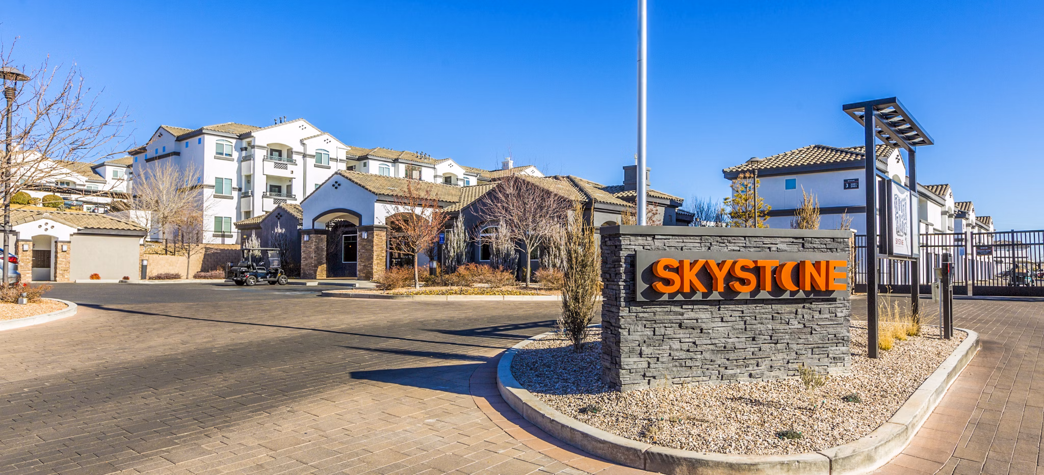 SkyStone Apartments: Modern entrance signage at luxury apartments in the city center