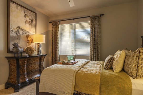 Cozy bedroom with modern decor in SkyStone Apartments