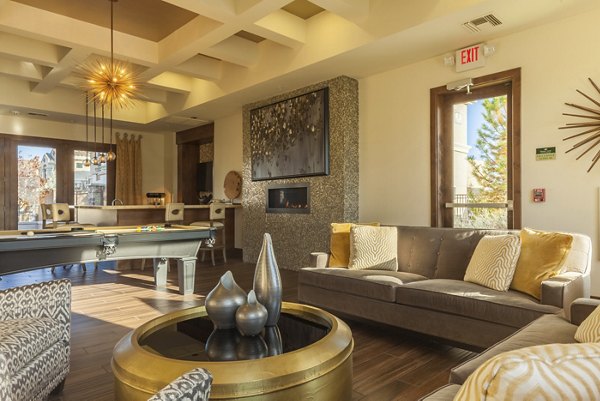 Clubhouse with modern furnishings and large windows at SkyStone Apartments offering luxury communal spaces in a Greystar residential community