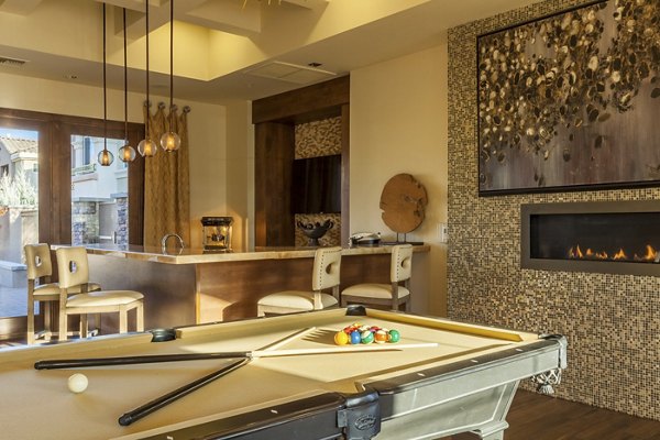 Game room with billiards and seating area in SkyStone Apartments, a luxury community with modern amenities designed for entertainment and relaxation