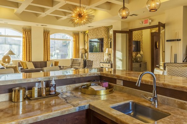 Modern clubhouse with luxurious seating and entertainment areas at SkyStone Apartments, offering comfort and style for residents