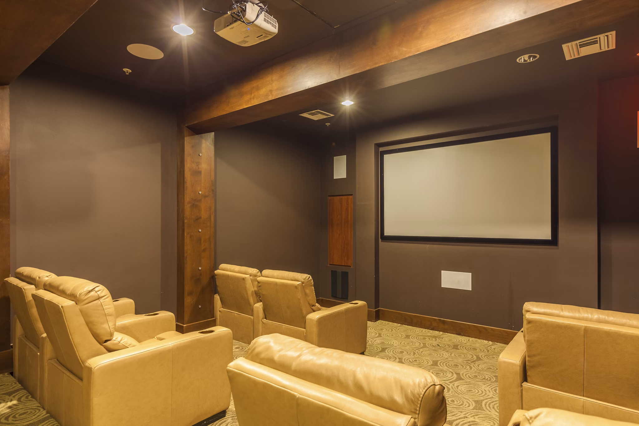 Modern theater with plush seating at SkyStone Apartments, perfect for movie nights and entertainment