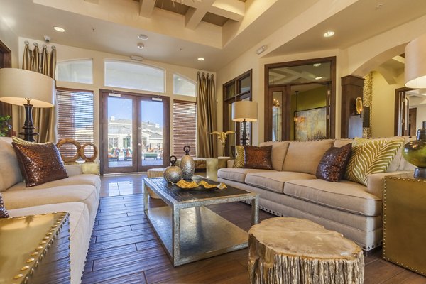 Modern clubhouse with lounge seating and billiards table at SkyStone Apartments in vibrant neighborhood