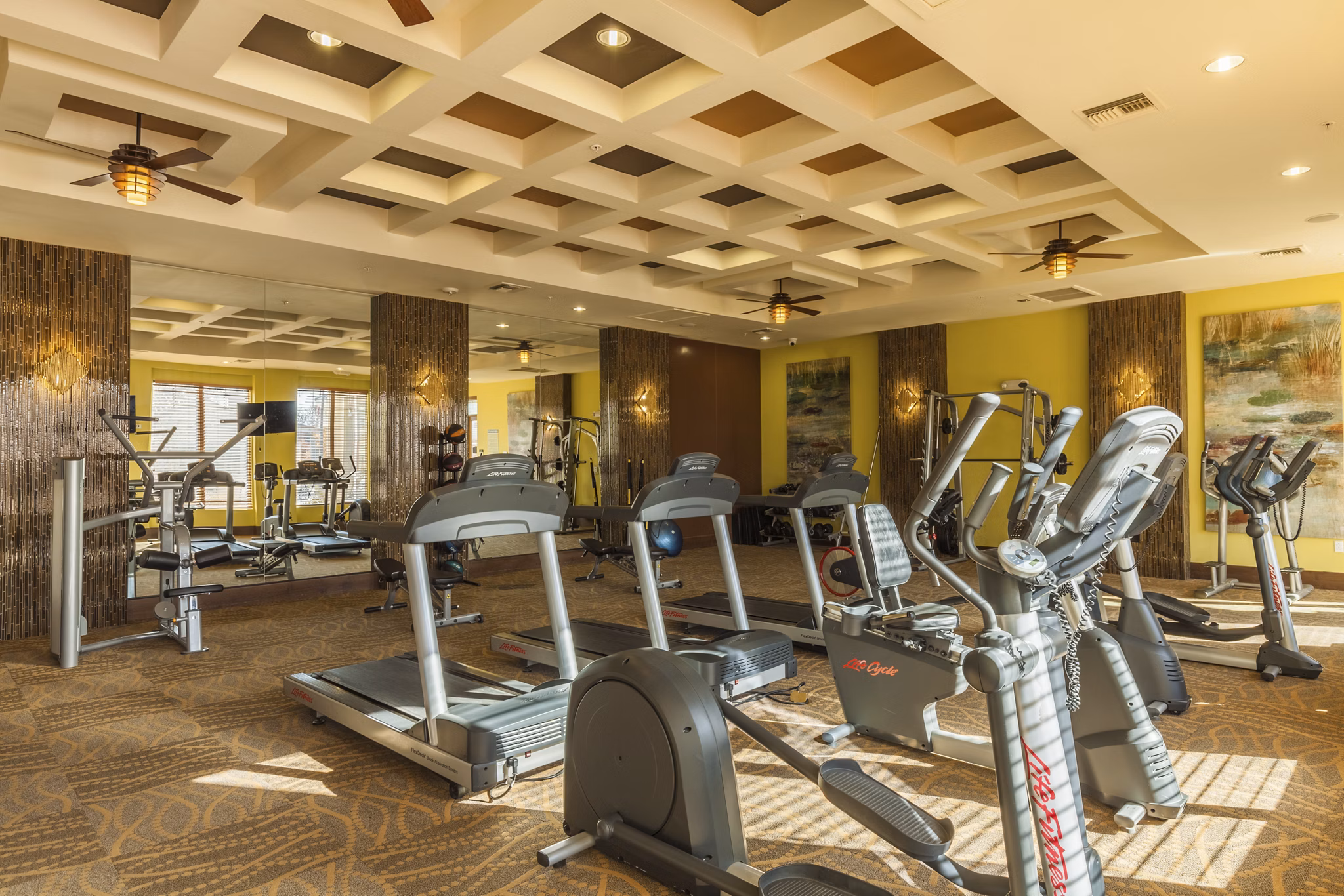 Fitness center with modern equipment at SkyStone Apartments
