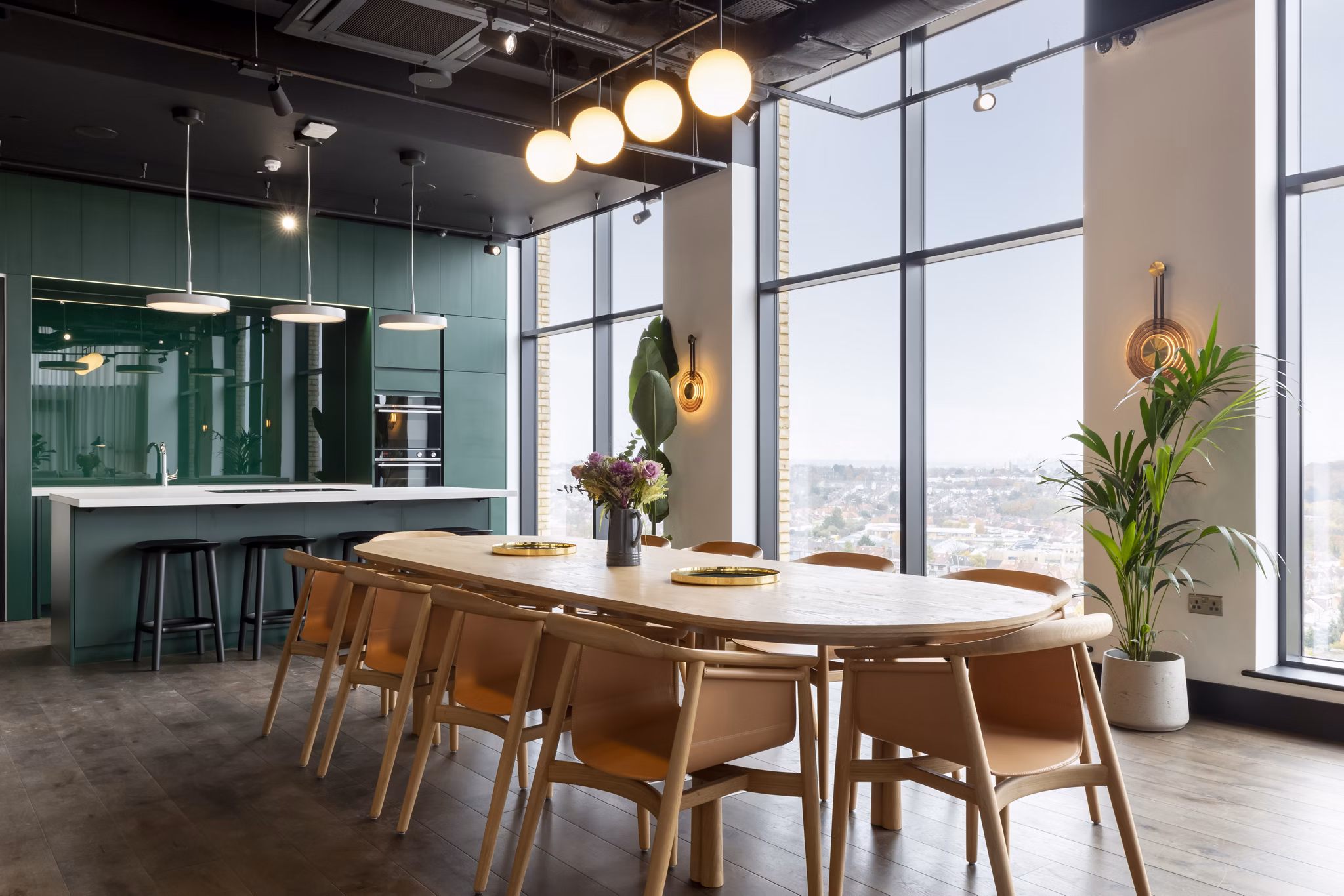 Elegant dining area at Greenford Quay Tillermans with large windows providing stunning views and natural lighting."