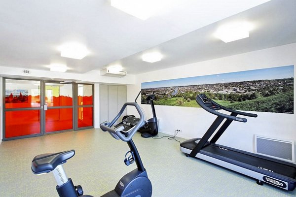 fitness center at MACSF Aubette Apartments